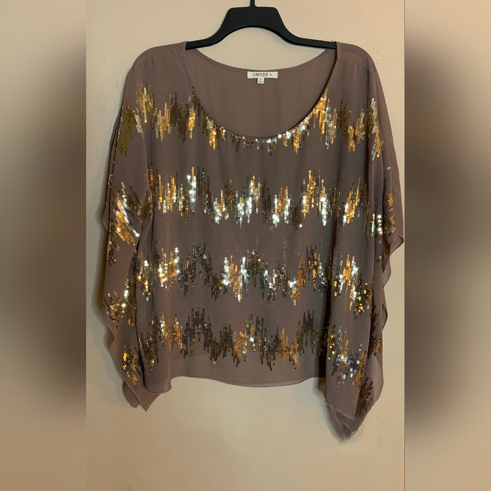 Umgee Sheer Angelwing blouse with sequined detailing.